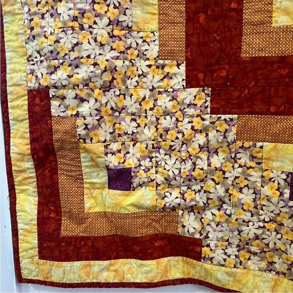 Hand crafted yellow square and floral quilt